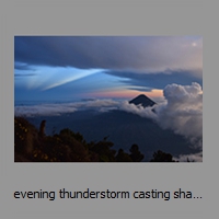 evening thunderstorm casting shadow 